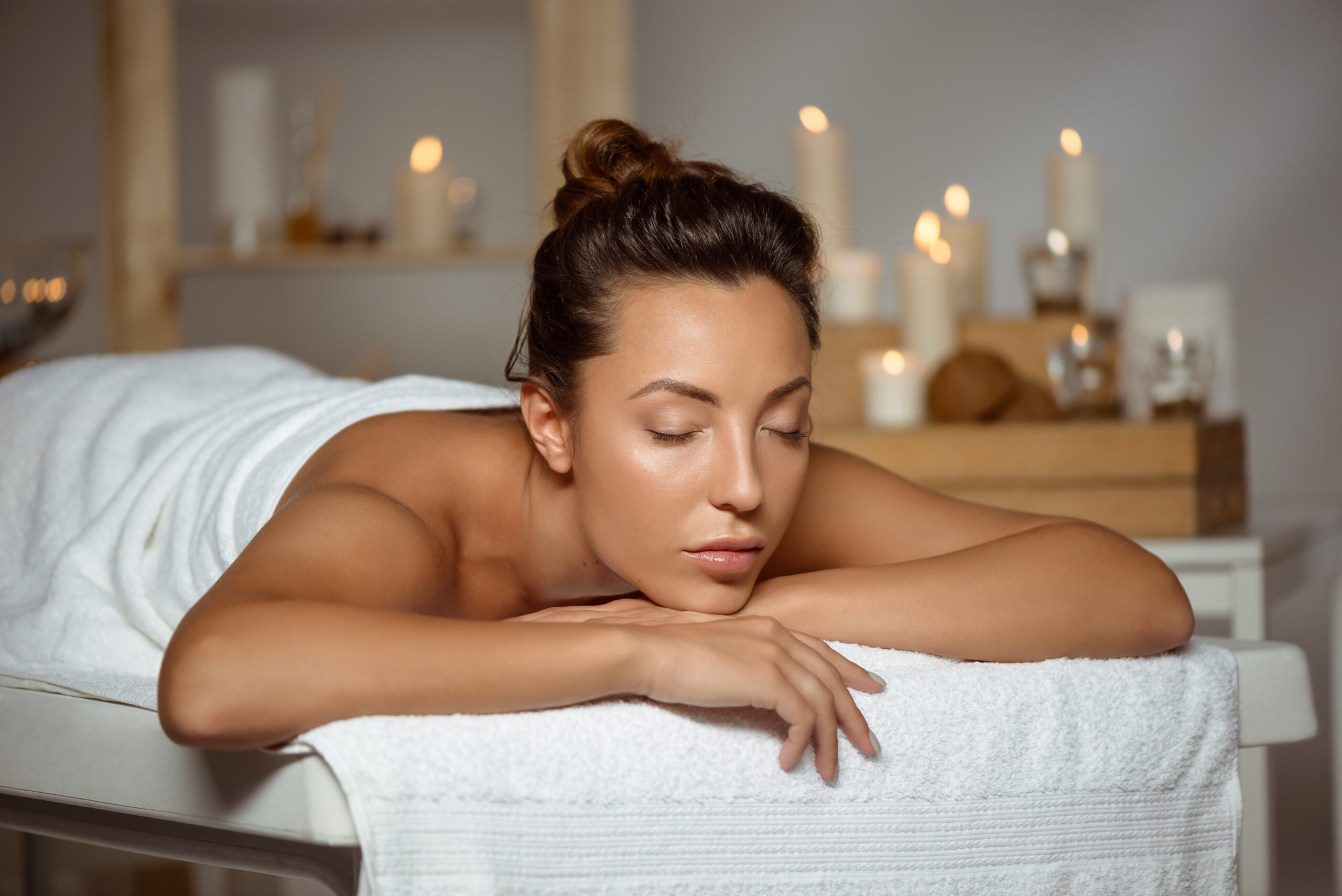 Young beautiful girl relaxing in spa salon